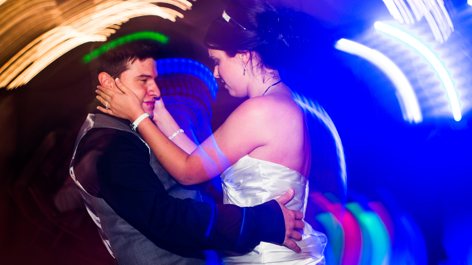 wedding photography and video in dallas of a married couple dating to the DJ's music.
